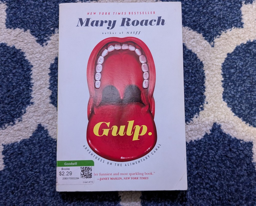 A photo of the book Gulp, by Mary Roach, with a discount stick on the bottom left indicating that it was bought used.